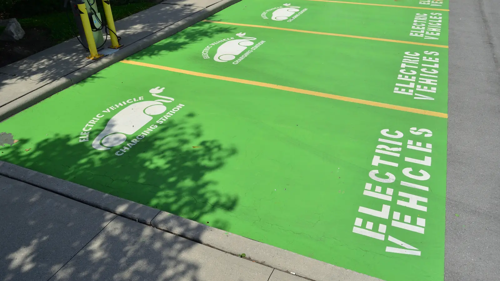 EV charging cost: parking spots reserved for electric vehicles next to a charging station