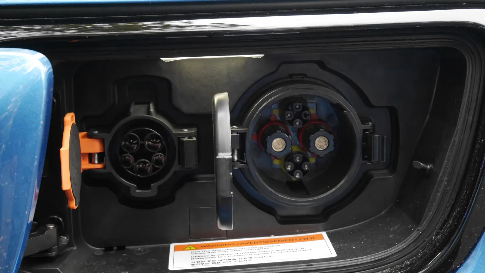 EV charger types: J1772 and CHAdeMO charging ports side by side on an electric car